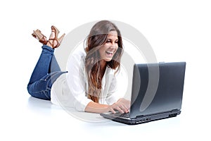 Attractive woman lying happy browsing in her laptop photo