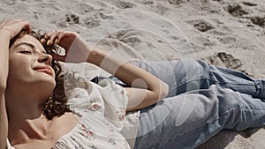 Attractive woman lying sand beach with boyfriend close up. Couple enjoy summer.