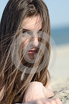 Attractive woman lying on sand wear bikini