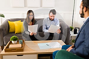 Attractive woman and man reading the divorce papers