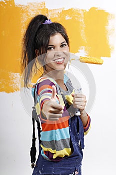 Attractive woman with paint brush