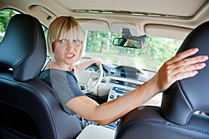 Attractive woman parking her car