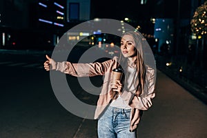 attractive woman in pink jacket hitching