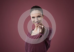 Attractive woman pointing forward
