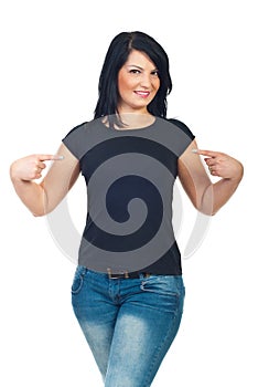 Attractive woman pointing to her t-shirt