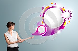 Attractive woman presenting abstract speech bubble copy space