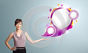 Attractive woman presenting abstract speech bubble copy space