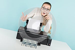 Attractive woman printing cash photo
