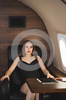 Attractive woman in private jet