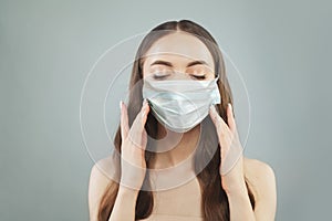 Attractive woman in protective mask