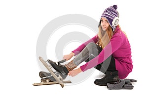 Attractive woman put on the ice skates