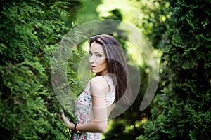 Attractive woman with ravenous glance in garden. Nature