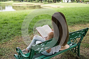 Attractive woman read book in park