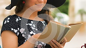 Attractive woman reading interesting novel book cafe, enjoying vacation, closeup
