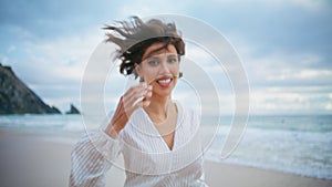 Attractive woman running beach in summer closeup. Carefree happy girl resting