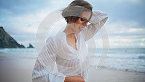 Attractive woman running beach in summer closeup. Carefree happy girl resting