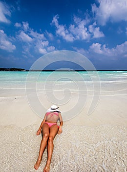 Attractive woman on a sandbank