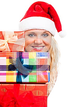 Attractive woman in Santa hat with Christmas gifts