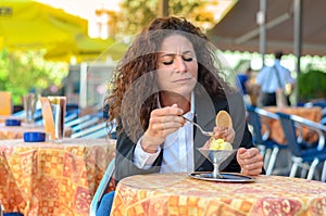 Attractive woman savoring an ice cream sundae