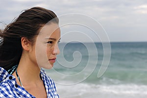 Attractive woman at the sea facing the future