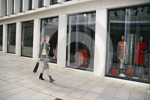 Attractive woman with shoppingbag in a mall