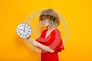 Attractive woman with short curly hair with clocks