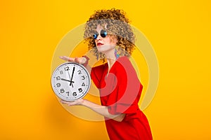 Attractive woman with short curly hair with clocks