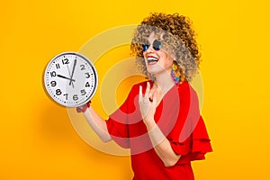 Attractive woman with short curly hair with clocks