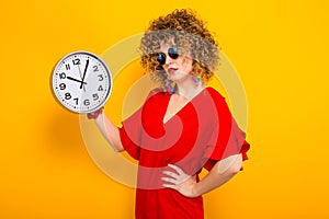 Attractive woman with short curly hair with clocks