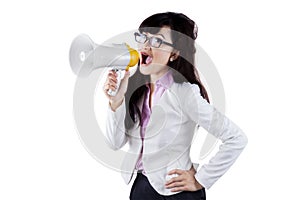 Attractive woman shouting with megaphone