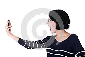 Attractive woman shouting to the phone.