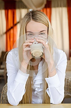 Attractive woman sitting in cafe