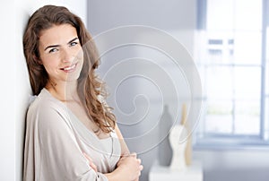 Attractive woman smiling happily at home photo