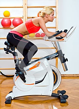 Attractive woman on stationary bike