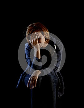 Attractive woman suffering depression and stress alone in pain and grief