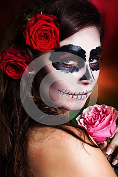 Attractive woman with sugar skull make-up