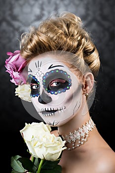 Attractive woman with sugar skull make-up