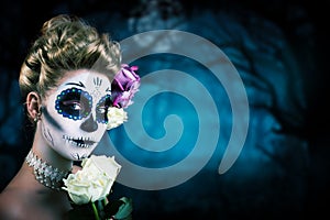 Attractive woman with sugar skull make-up