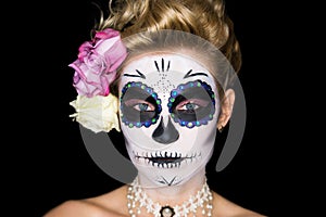 Attractive woman with sugar skull make-up