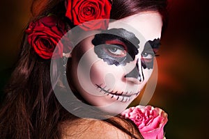 Attractive woman with sugar skull make-up