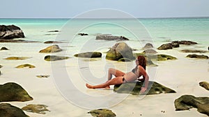 Attractive woman sunbathing in gorgeous crystal water, cambodia
