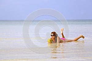 attractive woman sunbathing in gorgeous crystal water, cambodia