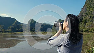 Attractive woman taking pictures