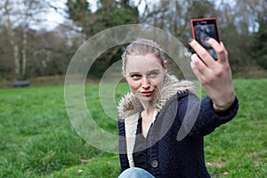 Attractive woman taking a selfie on her mobile