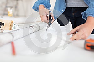 attractive woman tinkering in home workshop