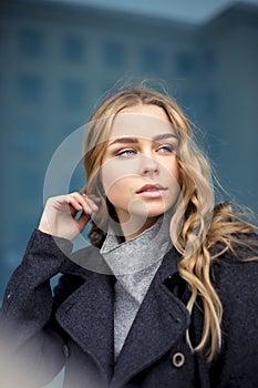 Attractive woman in town in winter time