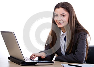 Attractive woman typing on laptop