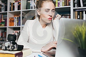 Attractive Woman Uses Laptop. Education, Online shopping, Remote Work And Other Meanings Concept photo