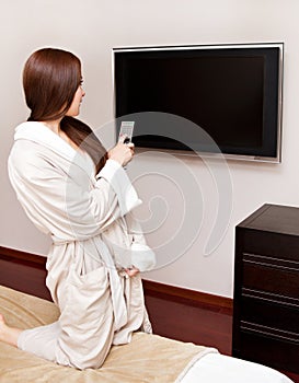 Attractive woman watching TV