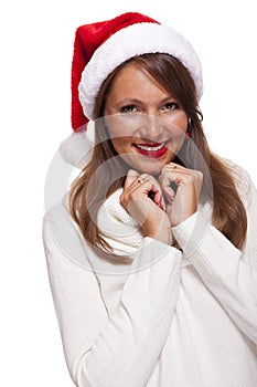 Attractive woman wearing a festive red Santa hat